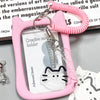 A pink crystal clear card holder with a cat charm and a pink beaded keychain.
