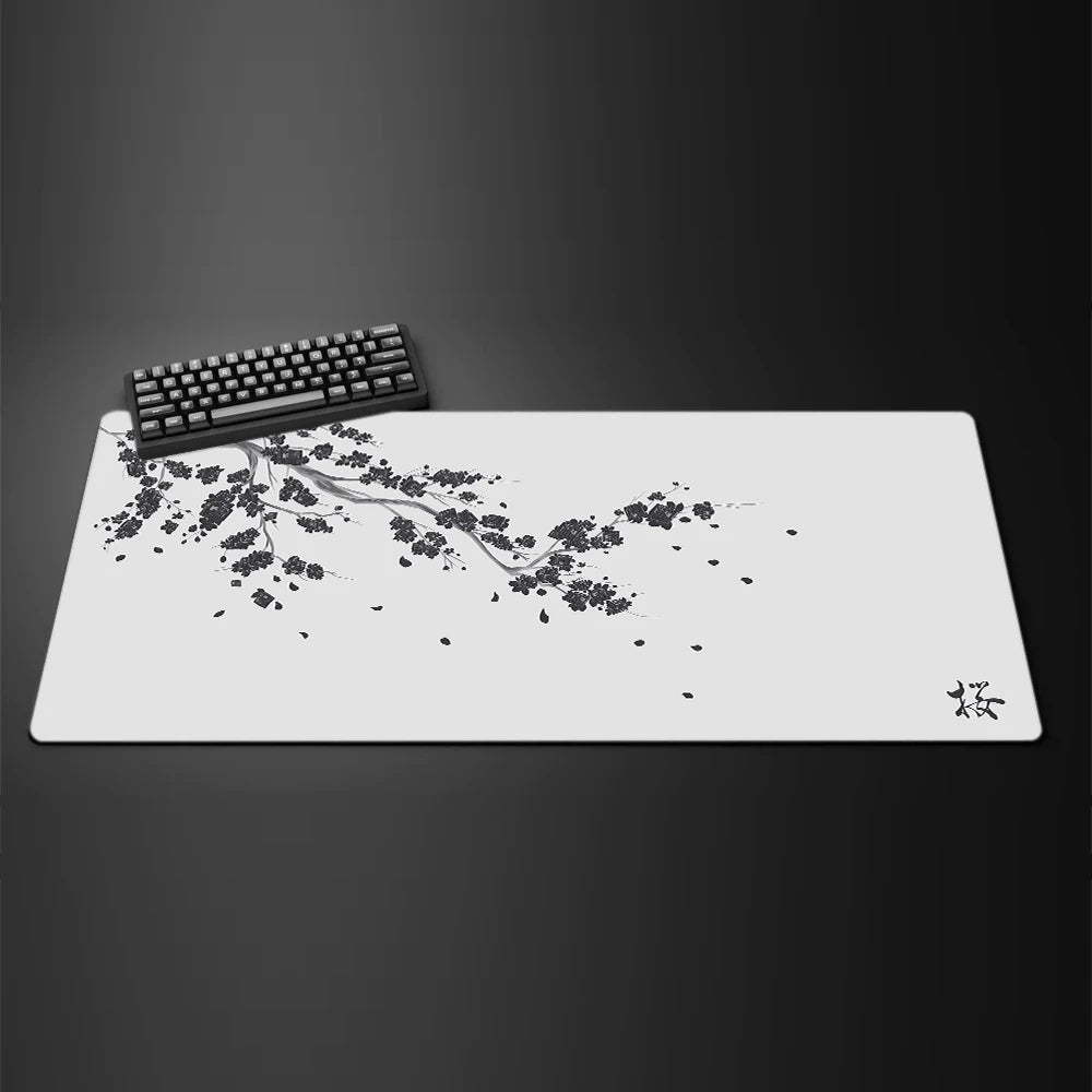 A white gaming mouse pad featuring a delicate black cherry blossom branch design.