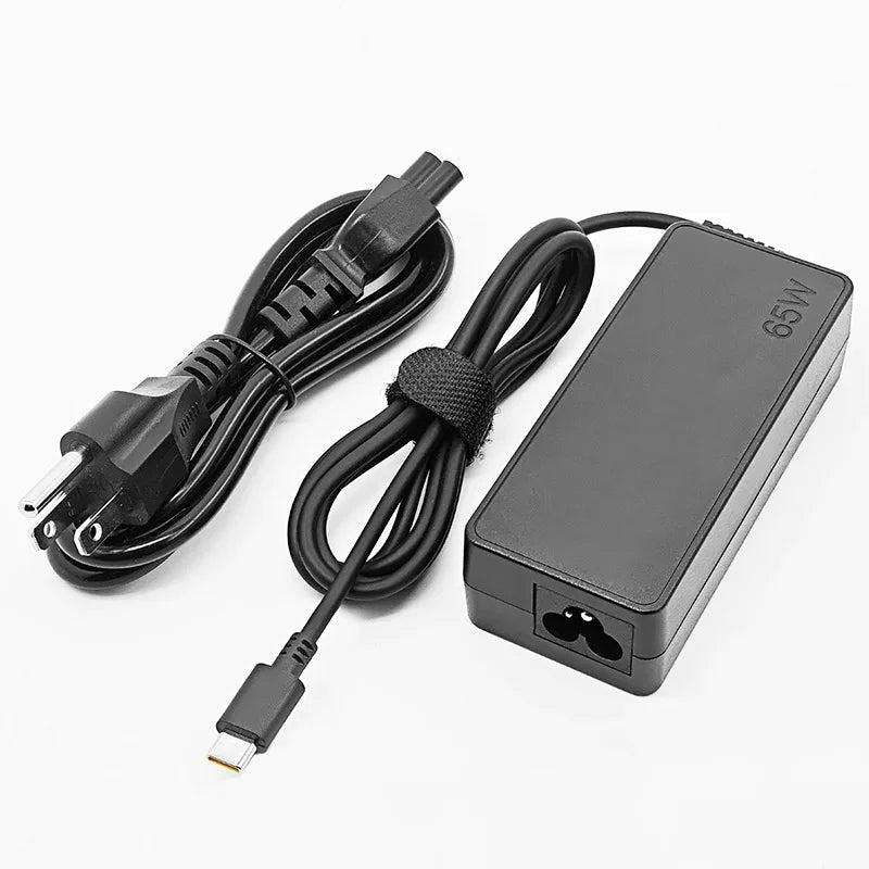 A black universal 65W USB-C laptop charger with a cable and power adapter.