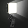 A small clip-on LED fill light with a bright white light emitting from the front.