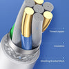 Close-up view of a thick wire upgrade cable with tinned copper conductors and insulation inside a protective braiding mesh.