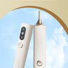 A pair of white electric diamond painting pens, a dot drill pen kit, shown against a light blue sky background.