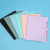 A set of pastel colored A4 document accordion folders with snap buttons arranged diagonally on a light blue background.