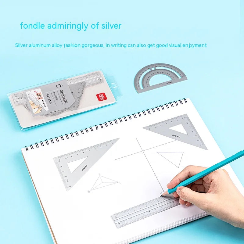A set of silver aluminum drafting rulers and a pencil drawing geometric shapes on paper.