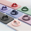 A collection of magnetic silicone phone grips in various colors and finishes displayed on a white surface.