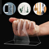 A hand holds a finger covered in clear adhesive tape, demonstrating the grip and application of heavy duty nano double-sided 