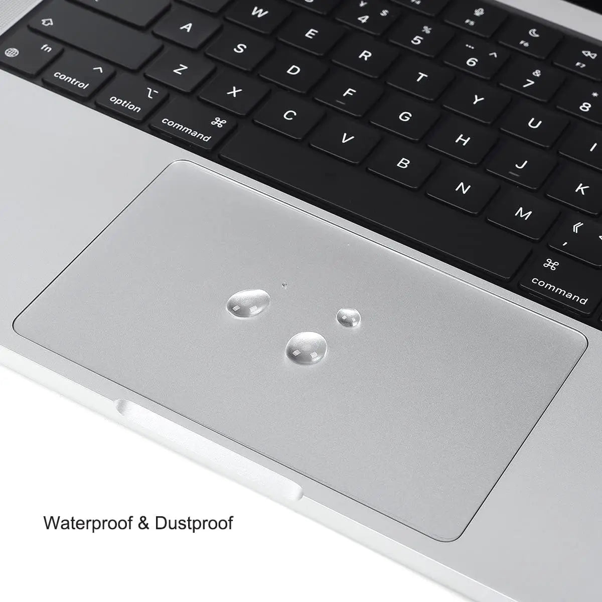 A close-up view of a silver laptop trackpad with a protective film applied, showing waterproof and dustproof features.