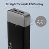 A black power bank with a straightforward LED display showing 100% charge and temperature.