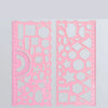 A pink multi-shape geometric drawing template ruler set with various shapes cut out of clear plastic.