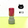 A red and gray teacher stamp with a black cat face design labeled M13.