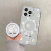 A clear floral magnetic phone case for an iPhone featuring white daisy designs.
