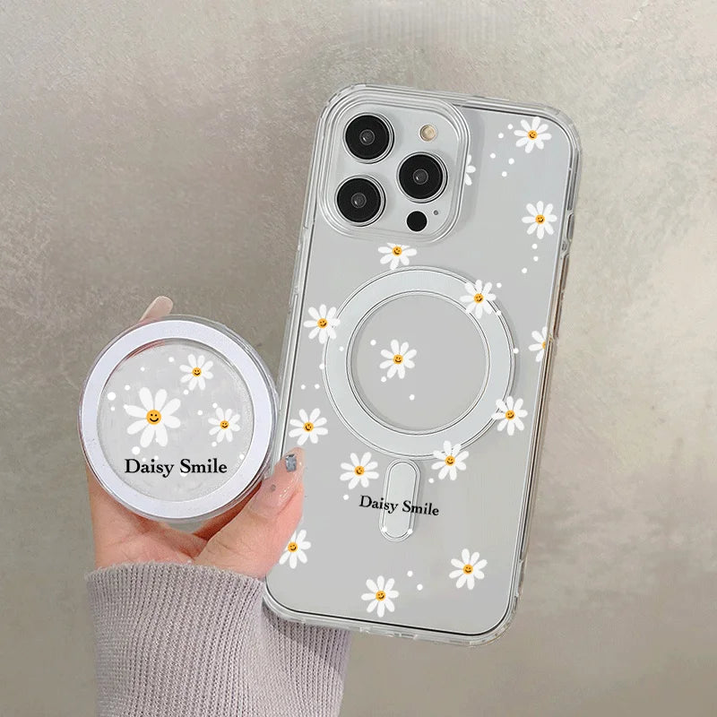 A clear floral magnetic phone case for an iPhone featuring white daisy designs.