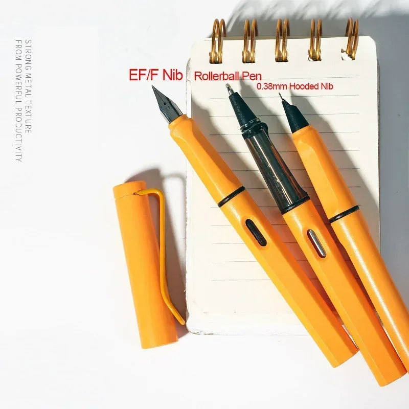 A set of three orange rollerball pens with gold nibs resting on a white lined notepad.