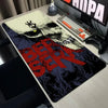 A large gaming desk mat featuring a stylized Berserk skull design for a mouse pad.