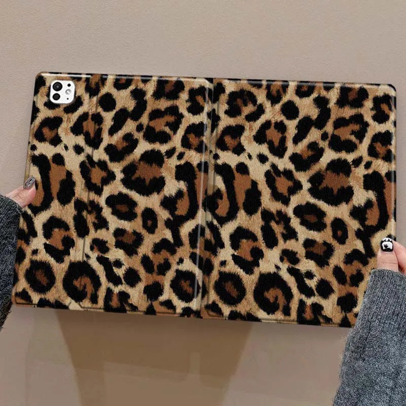 A leopard print protective skin for an iPad case is shown being held by a hand.