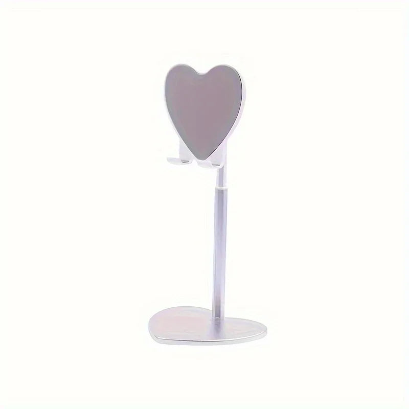 A silver adjustable desktop phone and tablet stand with a heart-shaped holder.