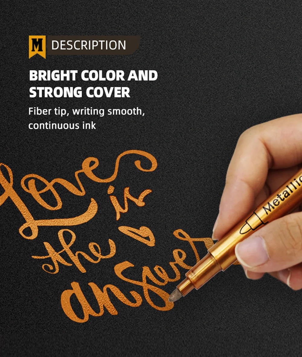 A hand is writing the phrase Love is the answer in orange metallic ink on a dark surface with a brush marker pen.