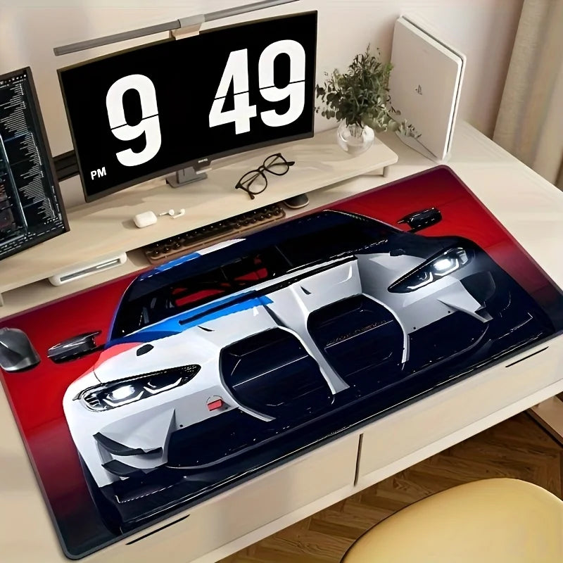 A large non-slip gaming mouse pad featuring a racing car design on a white and blue vehicle.