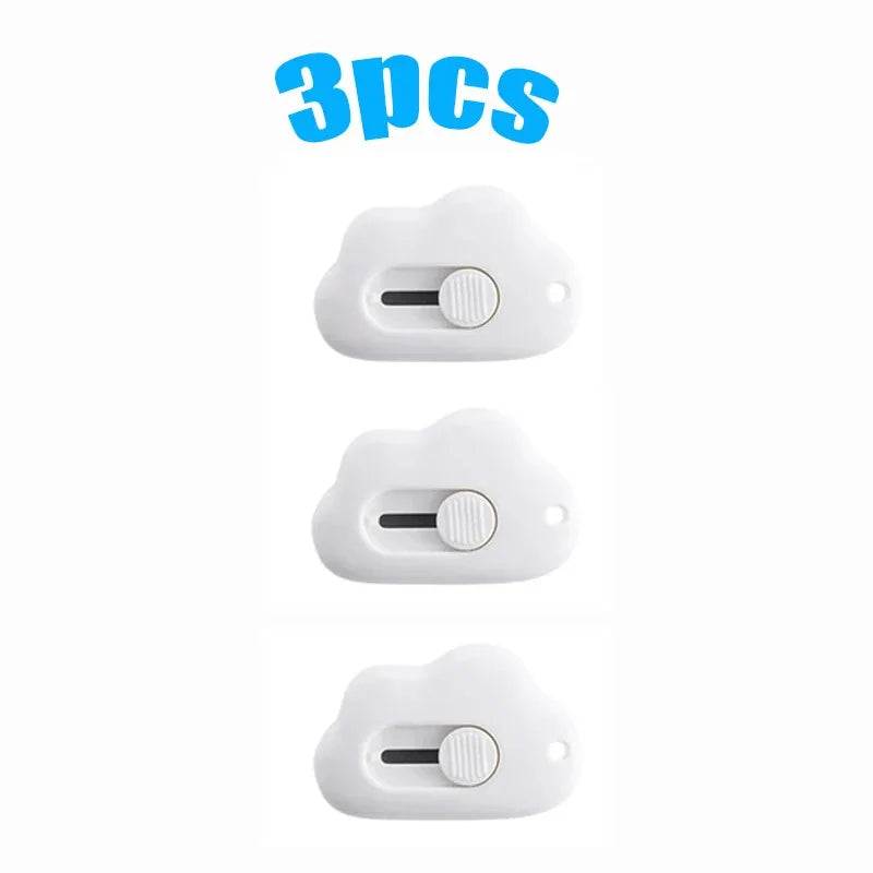 Three white utility knives or openers are displayed against a white background.
