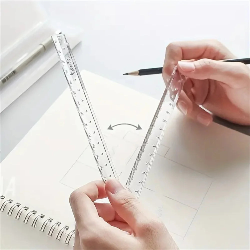 A hand holds a precision acrylic folding ruler set, demonstrating its measurement markings on a sheet of paper.