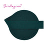 A dark teal or forest green elastic hair tie with a flat band design.