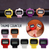 A collection of various colored thumb counters and digital clickers shown in different orientations.