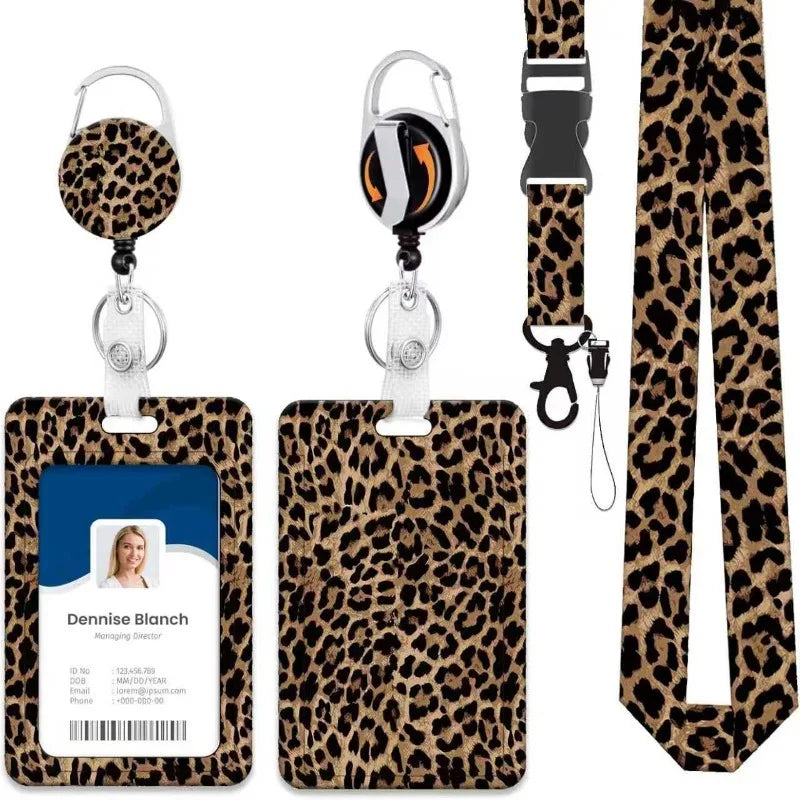 A leopard print retractable ID badge holder with a silver clip and black lanyard.