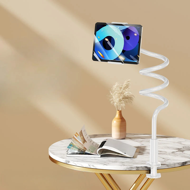 A 360° rotating tablet and phone stand with a flexible spiral base resting on a marble table.