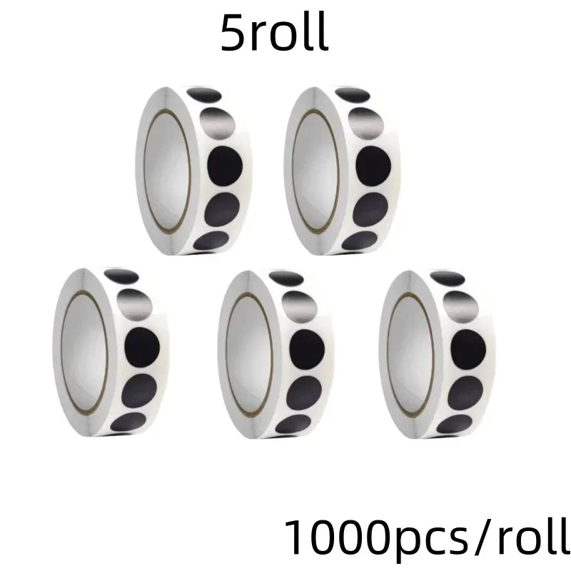 Five rolls of round dot labels used for organization