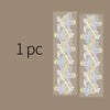 A pair of decorative silver stamping lace tape featuring purple and yellow floral patterns on a beige background.