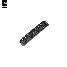 A black ruler bookmark with millimeter markings for measuring or marking.