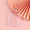 Clear acrylic card holder with a pink key ring displayed on a light pink background.