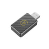 A black adapter for wireless CarPlay and Android Auto, featuring a yellow triangle icon on the surface.