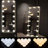 A set of round LED vanity mirrors and light fixtures displayed on a black background.
