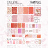 A collection of pink and coral colored scented paper sheets for crafting and scrapbooking