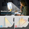 A woman is using a monitor light bar to reduce glare and fatigue while working on a computer.