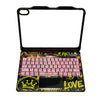 A black keyboard case with a magnetic lid, featuring a pink key layout and an RGB backlit trackpad.