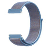 A light blue nylon loop watch strap with a woven texture and a rectangular buckle is shown in a curved shape.