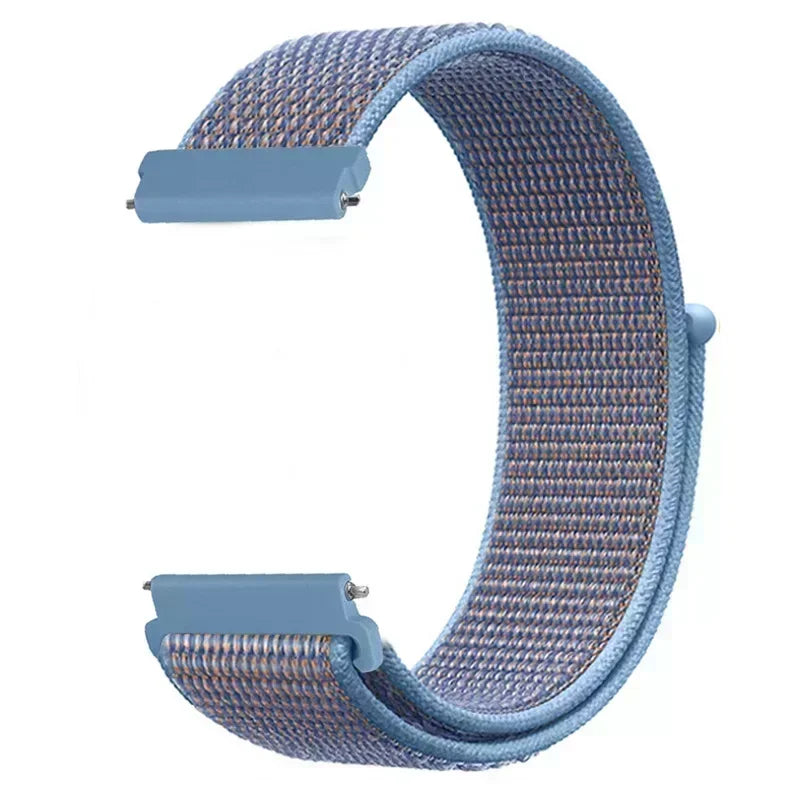 A light blue nylon loop watch strap with a woven texture and a rectangular buckle is shown in a curved shape.