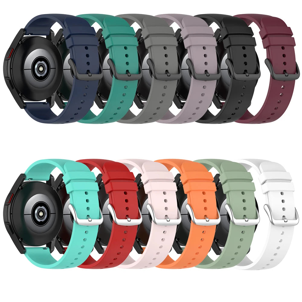 A variety of silicone watch bands in multiple colors, including blue, green, gray, purple, and orange, displayed together.