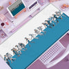 Anime-inspired XXL gaming mouse pad featuring a dynamic battle scene with figures in blue and white against a teal background