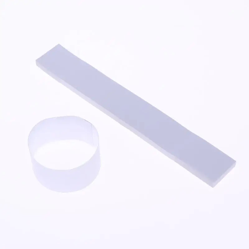 A white self-sealing money strap is shown next to its circular form.