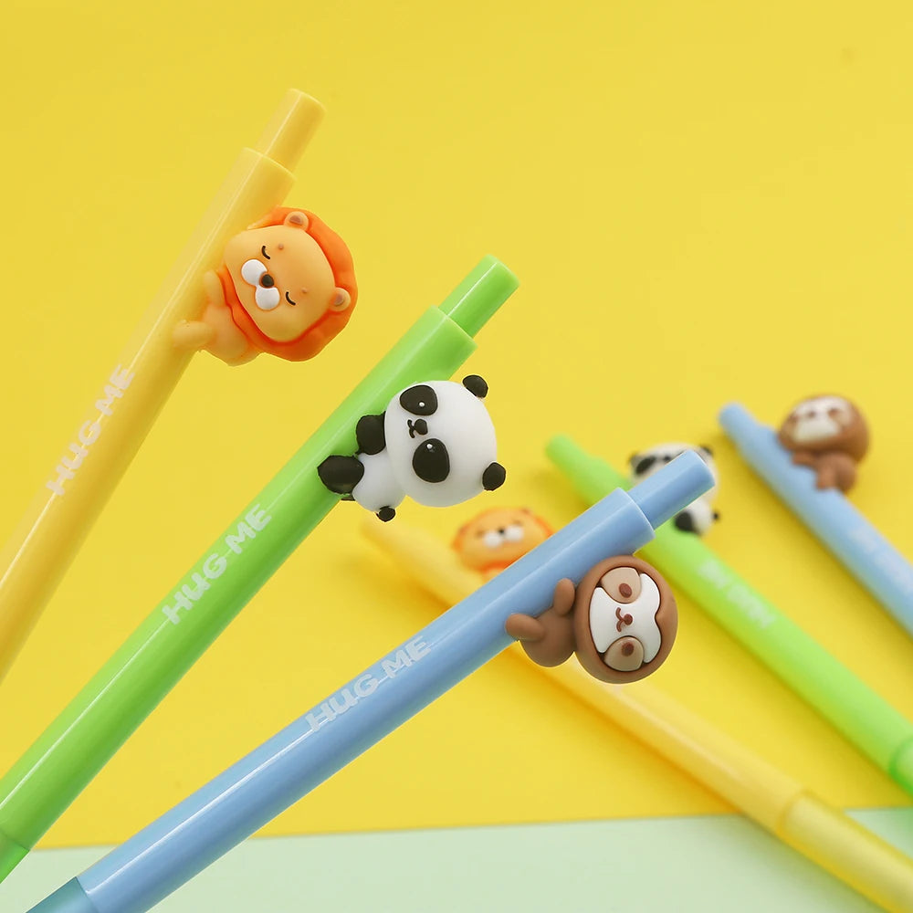 A set of three cute mechanical pencils featuring mini animal designs like a lion, panda, and monkey on a yellow background.