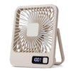 A beige portable USB rechargeable desk fan with a protective grille and a handle.