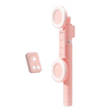 A pink multifunctional selfie stick tripod with a wireless light attached.