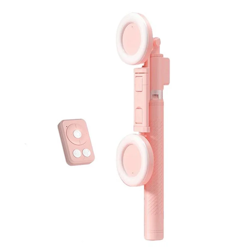 A pink multifunctional selfie stick tripod with a wireless light attached.
