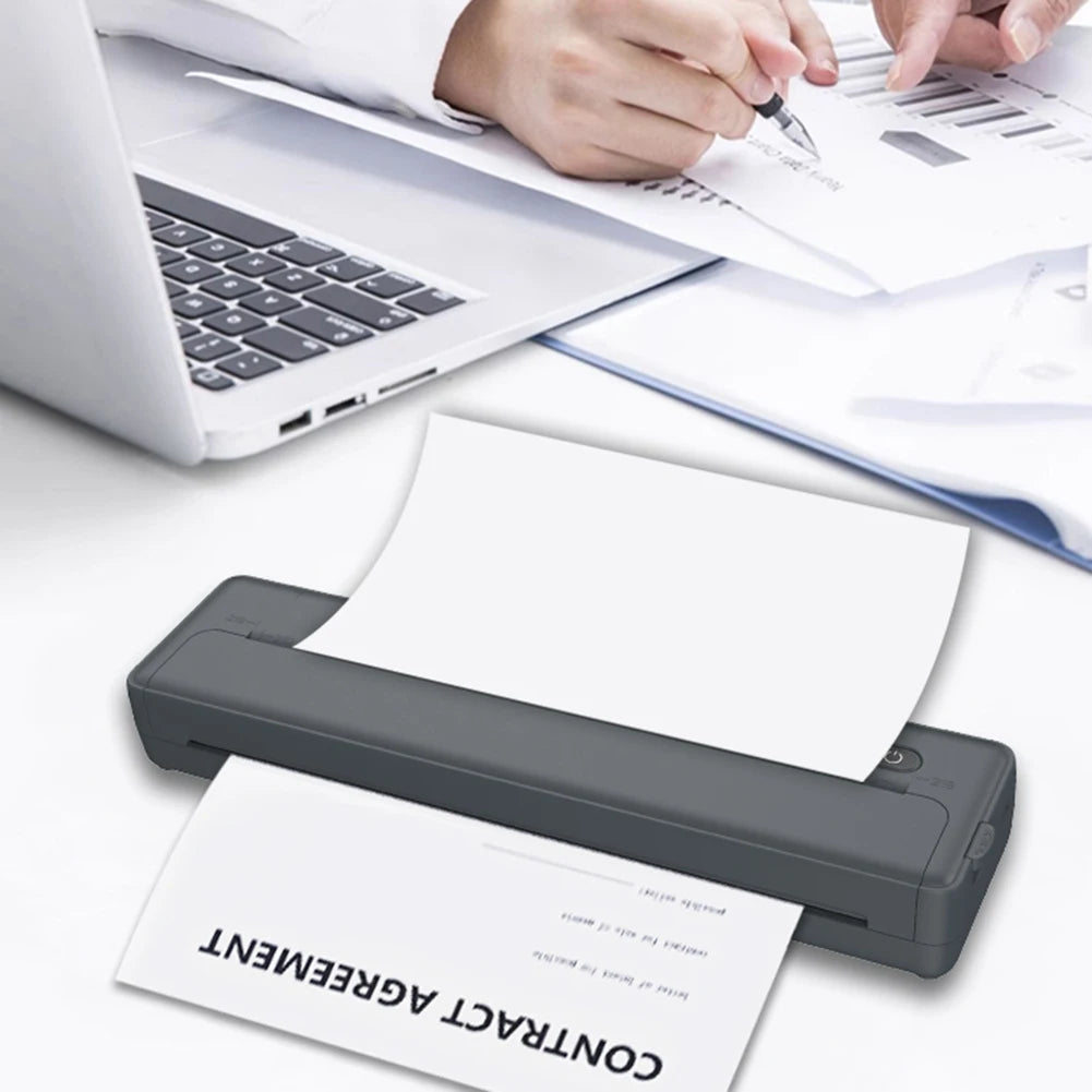 A close-up of a black thermal paper contract agreement being printed on an A4 thermal paper printer.