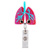 A cartoon medical anatomy pin featuring a pink lung with blue bronchial tubes and a silver retractable badge reel holder.