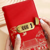 A red personal finance budget binder with a gold lock is held by a hand, featuring an intricate traditional Chinese architect
