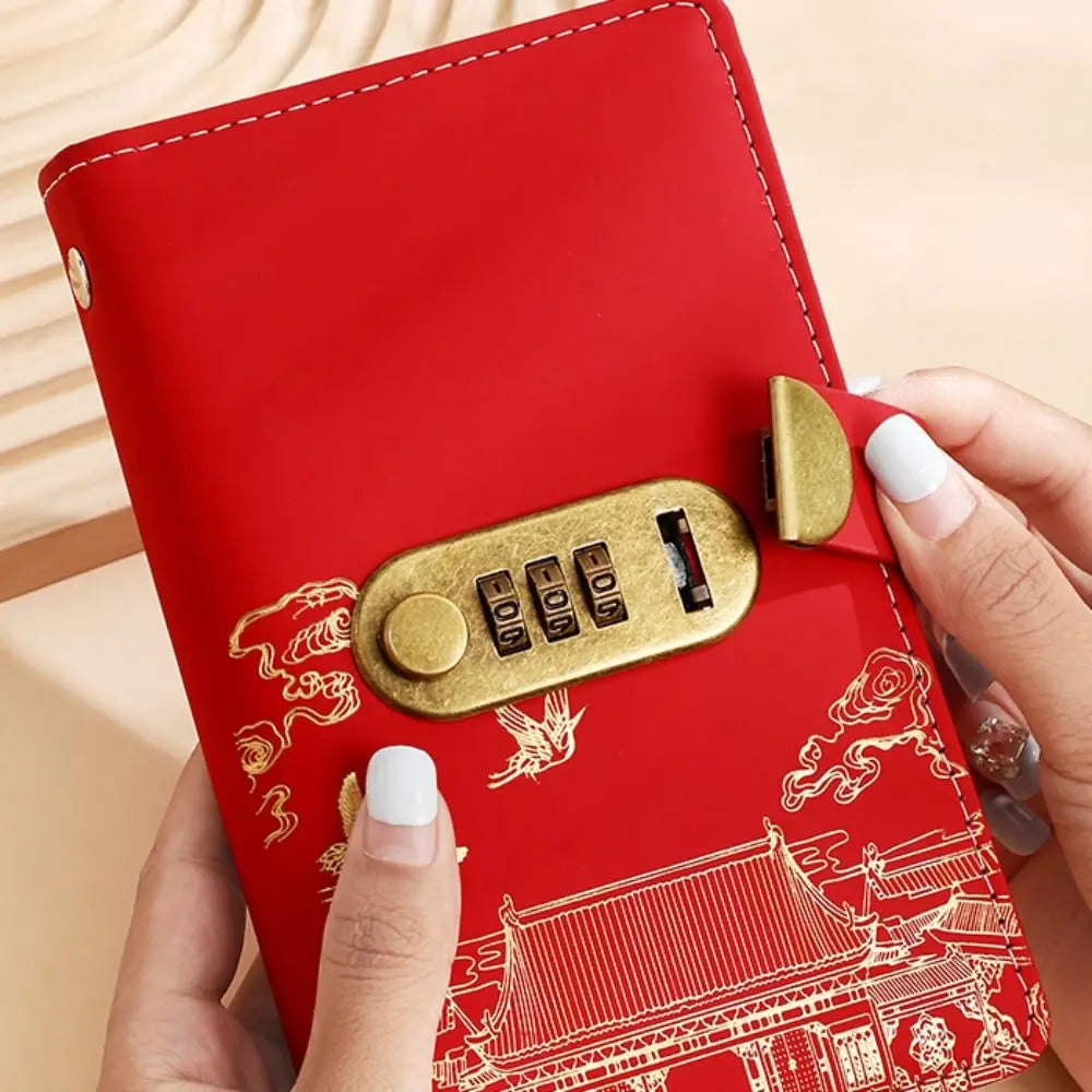 A red personal finance budget binder with a gold lock is held by a hand, featuring an intricate traditional Chinese architect